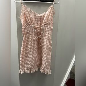 Pinkish peach plaid long blouse sleeveless.